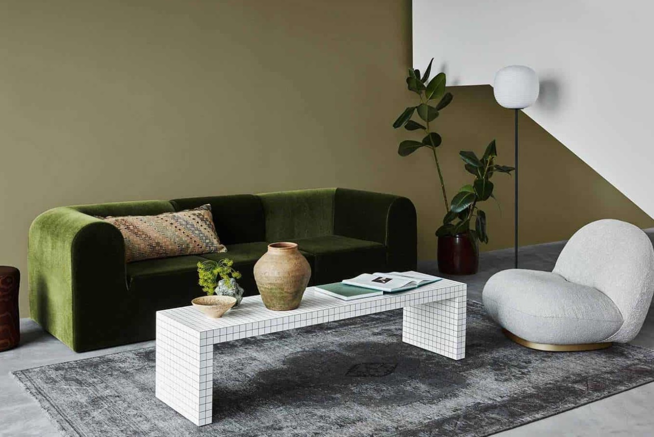 salon mur canapé vert table boudin blanc tendances déco