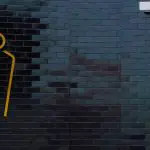 Déco WC tendances : optez pour du noir ! black-brick-wall-and-toilet-sign-for-abstract-back-2023-11-27-05-05-43-utc